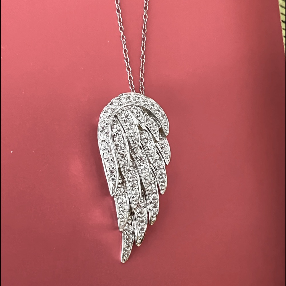 This all silver chain and crystal rich wing resembles a wing and a prayer.